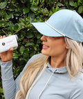 Woman using Vpro Golf Rangefinder With Pinsensor And Flag Lock, 900 Yards Slope Laser, 6X Magnification, outdoors