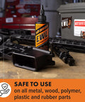 Extreme Weapons Lubricant EWL Synthetic CLP Gun Lube Spray 16oz bottle with rifle parts on workbench