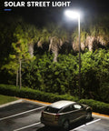 500W Solar Street Lights Outdoor 20000 Lumens LED Solar Parking Lot Lights Dusk To Dawn Sensor illuminating a parking area