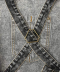 Back view of black durable denim work apron with cross back straps detail for Denim Hair Stylist Tool Apron With Pockets For Women.