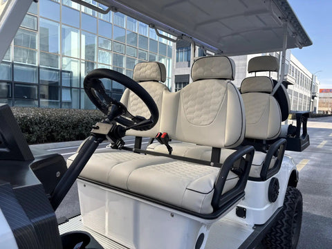 Rock Solid 6 Seater Electric Golf Cart With 48V Lithium Battery And 14 Inch Off Road Tires White interior seating with plush gray upholstery.