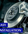 Front brake rotor with silver caliper on a vehicle; close-up view.