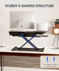 35 Inch Electric Standing Desk Converter With Slick Quiet Lift Height Adjustable Stand Up Riser Dual Monitor And Laptop Setup Wide Keyboard Tray Black Finish on desk