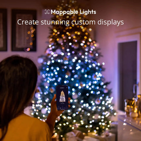 Person using app to control Smart LED String Lights 400 LEDs for Indoor and Outdoor Use, 105ft, decorating tree