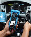 Person using Pro Grade Inrush Clamp Meter Multimeter 1000A True RMS 6000 Counts AC DC Current And Voltage Tester in car dashboard