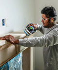 Person using Granat Profile Soft 5 Inch 125 mm Sanding Discs 10 Pack With Flexible Foam Backing for contours on a wooden surface.