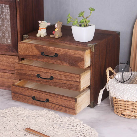 Wooden cabinet with open drawers, featuring mini black zinc alloy knobs from Set Of 20 Vintage Mini 2 Inch Drawer Knobs And Jewelry Box Pulls.