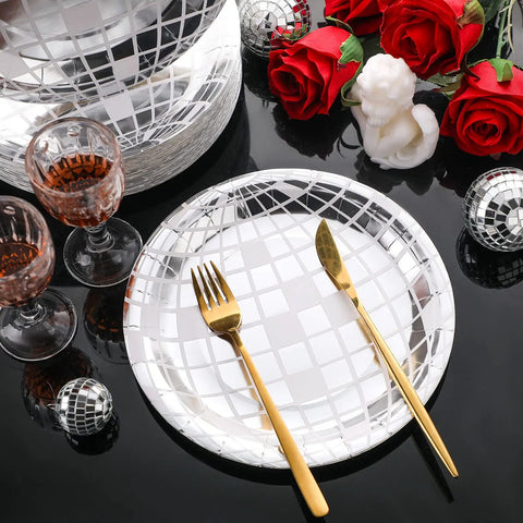 Totally Perfect 100 Pack 9 Inch Silver Disco Plates For 70s Party Decor with gold cutlery and disco balls on table