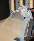 Adjustable eye shield on Workshop Beast 200 Millimeter Bench Grinder for safety during metal cutting and tool sharpening.