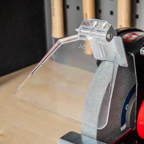 Adjustable eye shield on Workshop Beast 200 Millimeter Bench Grinder for safety during metal cutting and tool sharpening.