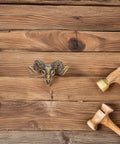 Brass Goat Head Cabinet Knob Pull Handle Vintage Animal Drawer Knob For Kitchen Cabinets And Dresser Rustic Metal Cupboard Hardware Durable Goat Head Design With Premium Craftsmanship Ideal Rustic Farmhouse Decor on wood surface