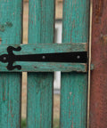 Heavy Duty 8 Inch Weld On Metal Screen Door Hinges Built Tough From Iron For Barn Garage Shed And Residential Doors With Easy Install And Remove For Long Lasting Durability shown on a rustic wooden door.