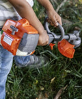 Child using 223L Toy Trimmer With Realistic Sounds And Light Up Trimmer Line For Kids Ages 3 And Up A Kid Friendly Weed Eater Play Tool.
