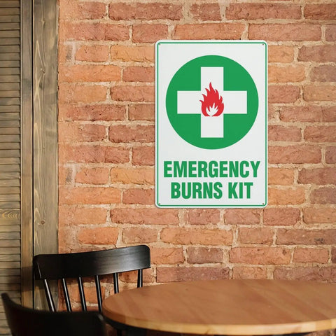 Rustproof Aluminum Warning Sign For First Aid Burn Kit Location 8 By 12 Inches With Clear Bold Lettering on brick wall indoors