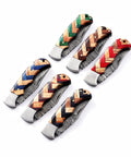 Colorful handles of handmade Damascus pocket folding knives with olive wood for EDC and camping. 150 layer Damascus blade in view.