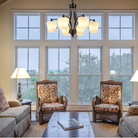 Six Light Large Chandelier With Alabaster Glass Shades In Oil Rubbed Bronze Finish hanging in a cozy living room setting.