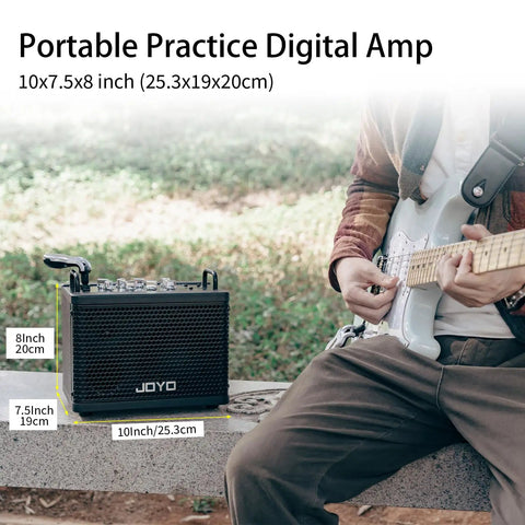 Musician with electric guitar sitting by 15W Portable Guitar Amp With 9 Preamp Models, Looper, Drum Machine outdoors