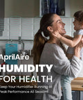 Mother holding child in kitchen, promoting AprilAire humidity for health