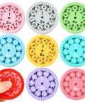 9 Piece Math Fidget Spinner Set For Kids Cool Spin Toy That Makes Multiplication And Division Fun, showing hand spinning red disk