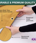Hands holding Waterproof Waxed Canvas Tarp Cover 8x10 Ft Heavy Duty Duck Cloth With Rustproof Brass Grommets, close-up on grommet.