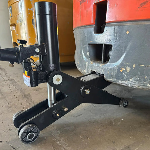 Beefy Hydraulic Forklift Jack With 10,000 Lb Capacity And 4000 Kg Scissor Lift beneath forklift, showing durable construction.