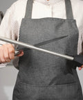 Person using Diamond Sharpener Rod For Knives With Built-In Angle Guides, 12-Inch, Extra Fine 1200 Grit in kitchen setting