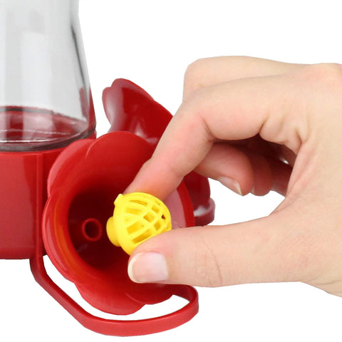 Hand installing Replacement Bee Guards For Hummingbird Feeders 205Y Yellow 4 Pack, Keeps Bees Out Of Nectar With Raised Barrier