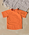 Toddler Orange Short Sleeve Rash Guard For Water Play With Tagless Comfort 82 Nylon 18 Elastane Sun Safe Swim Shirt That Keeps Sand And Sun At Bay Machine Wash Cold Inside Out Kid Friendly Fit.
