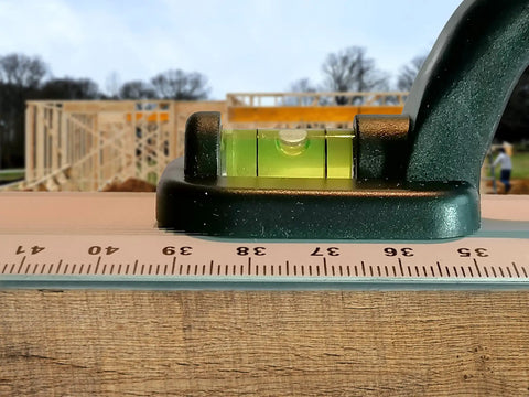 Aluminum Handle Ruler For Precise Cuts, 55cm Centimeter Ruler With Dual-Sided CM Markings on wooden surface