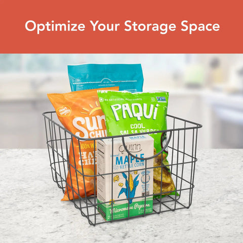 Industrial Gray Utility Basket With Easy Grip Handles For Kitchen Pantry Organization And Closet Shelf Bins Durable Steel Wire Container Open Grid Design Heavy Duty Shelving Essential Modern Home Vibes with snacks inside on countertop.