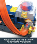 Police Station Track Set With Adjustable Loop And Four Lane Race 1:64 Scale Die Cast Vehicle Included Multi Path Stunts And City Chase Action For Kids Kid Friendly Durable Playworthy Raceway Fun showing loop and launcher