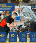 Budgit 2200 Series 1/2-ton pneumatic air hoist overhead in auto shop; gray metal unit with chain and hook