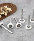 Quiet Nylon Garage Door Rollers 10 Pack 1.8 Inch Wheels With 4.7 Inch Stems Replaceable Whisper Quiet Operation For Garages Barns And Warehouses Heavy Duty And Easy To Install on concrete surface with dried flowers