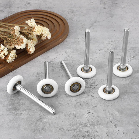 Quiet Nylon Garage Door Rollers 10 Pack 1.8 Inch Wheels With 4.7 Inch Stems Replaceable Whisper Quiet Operation For Garages Barns And Warehouses Heavy Duty And Easy To Install on concrete surface with dried flowers
