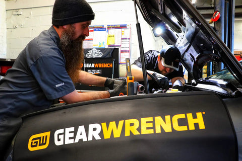Mechanic using Magnetic Fender Cover For Auto Repair, Thick Slip Resistant Vinyl Shield That Protects Your Car From Grease And Scratches While You Work Under The Hood.