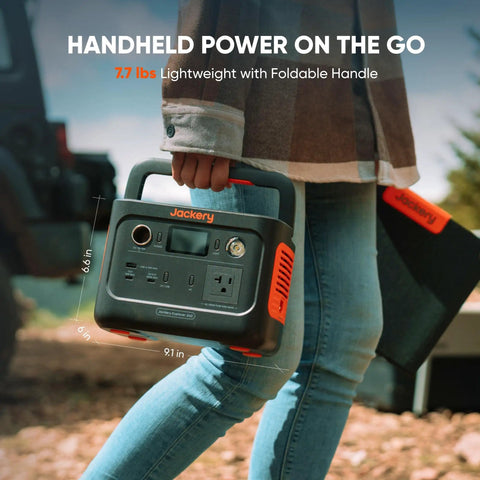 Person holding Solar Generator 240 V2 With 256Wh LiFePO4 Battery And 300W AC 100W USB C Output, ideal for outdoor use