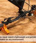 Two Pack Bike Repair Stands With Handlebar Support for Quick Bike Maintenance setup on sandy terrain