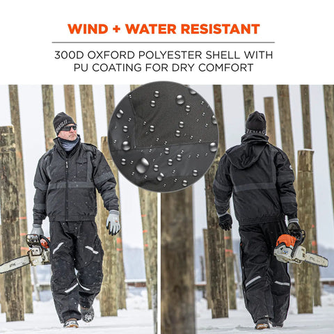Enhanced Visibility Winter Jacket For Night And Low Light Conditions, Black, X Large, with chainsaw in snowy setting.