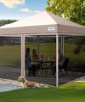 10x10 Pop Up Screened Canopy Tent With Mosquito Netting, Easy Up Outdoor Screen House Shelter setup on patio, used by people, dog outside