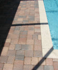 Tough As Nails Hydrophobic Acrylic Sealer For Masonry And Concrete Pavers delivers a slick water beading formula near swimming pool pavers.