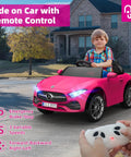 Child driving 12V Licensed Kids Ride On Electric Car With Remote Control, Pink Battery Powered Toddler Roadster, on driveway