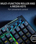 Top Tier Mechanical Gaming Keyboard With Kickass Clicky Green Switches And Lightning Fast Actuation Paired With Sleek Per Key RGB Underglow Lighting showing multi-function roller and media keys for convenient control.