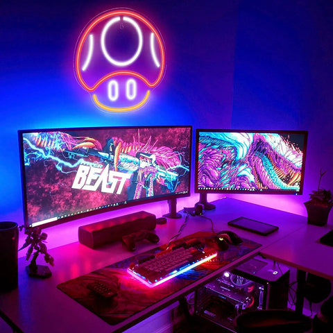 Mushroom Neon Sign For Gaming Room Decor Red LED Wall Light above dual monitors in a vibrant gaming setup.