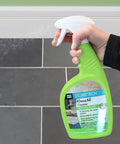 Hand spraying KlenzAll Heavy Duty Cleaner For Stone And Tile, Grout And Masonry, 24 Oz Spray Bottle, Breaks Down Tough Dirt And Grease