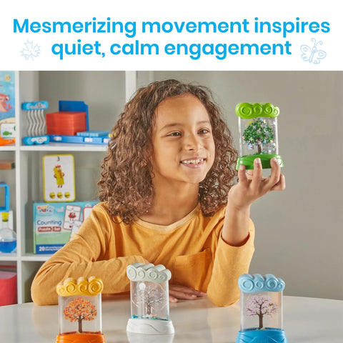 Child holding green Seasonal Sensory Tube For Calming Kids, Chill Out Fidgets For Travel And School, with other tubes on table