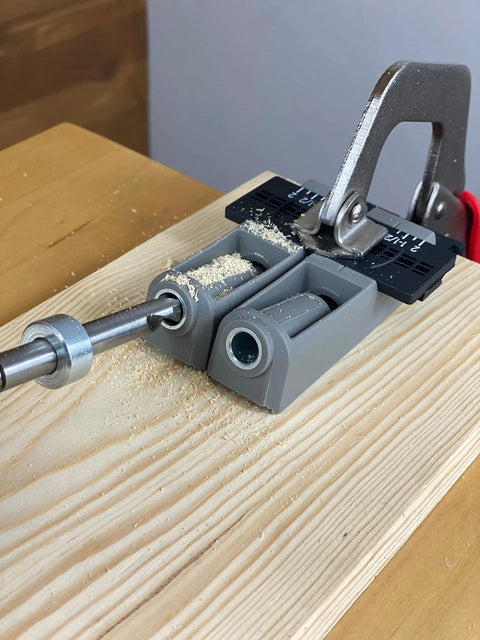 Twin Pocket Hole Jig Set With Adjustable Base And Magnetic Quick Adjust System in use on wooden board for woodworking joints
