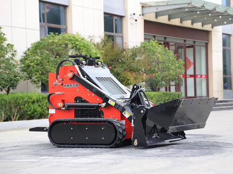 Side view of Mini Skid Steer Loader 1800 Lb Capacity With Four In One Bucket Attachment in a plaza setting