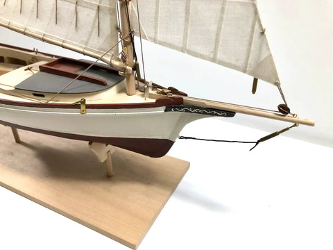 Close-up of the wooden ship model from Shipwright Series 3 Kits Trio with tools for adults, showcasing detailed mast and sails.