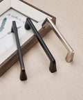 Set of three cabinet pulls, featuring the Twenty Five Pack Five Inch Dope Matte Black Cabinet Pulls for Bedroom and Bathroom.