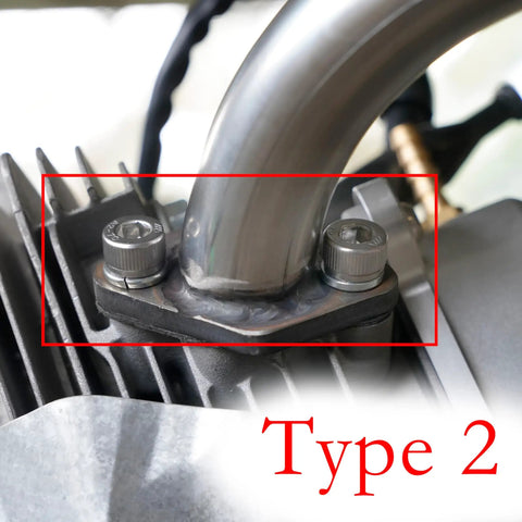 Close-up of Exhaust Muffler Pipe Mounting Hardware Studs Kit installed on engine, showing studs and bolts, Type 2, rugged design.
